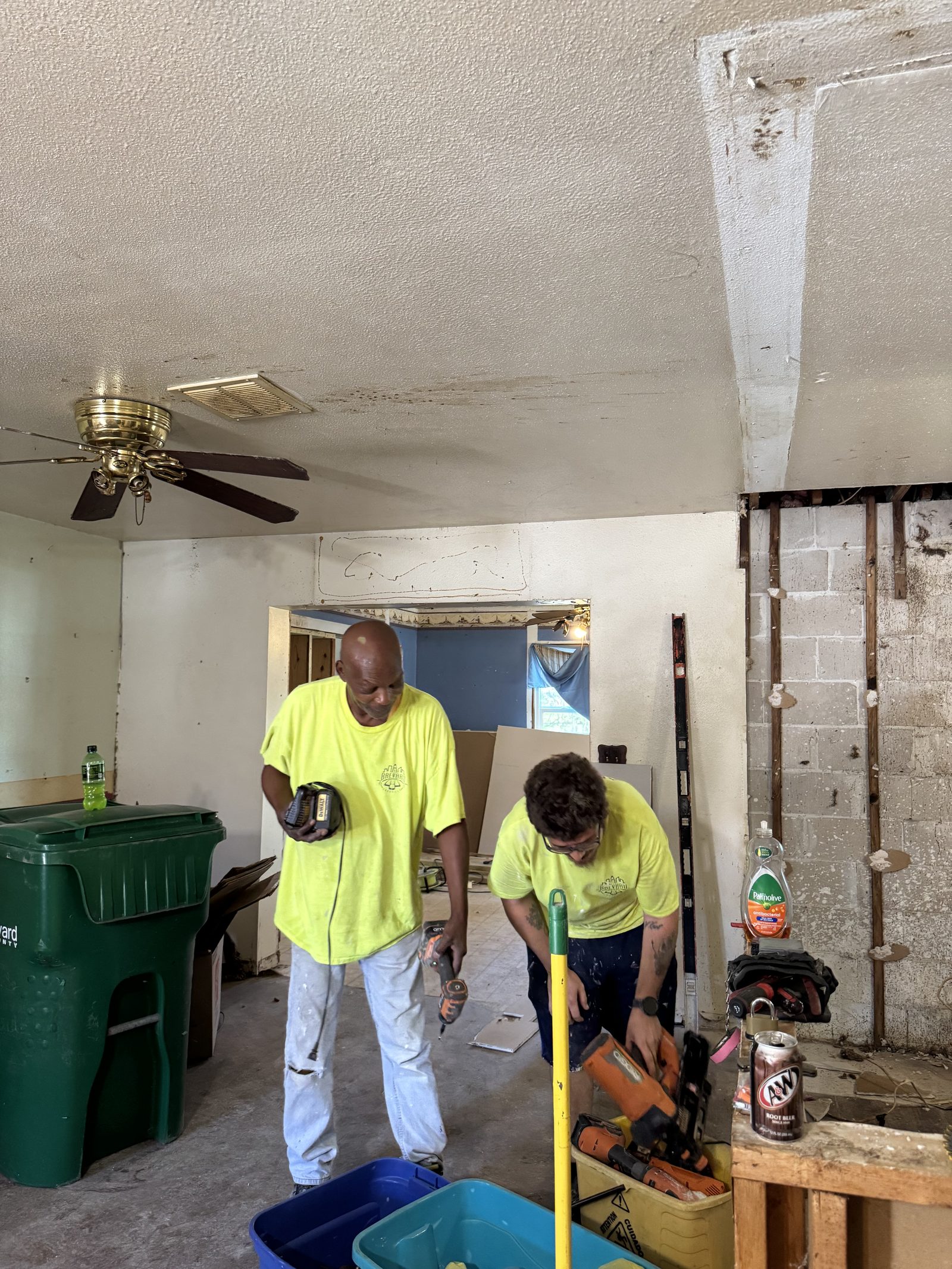 Crew clearing out a gutted room