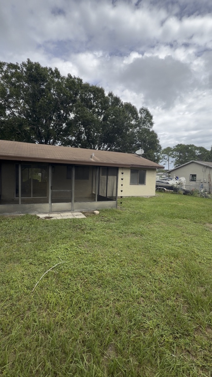 Out back: the screened porch and fenced back yard