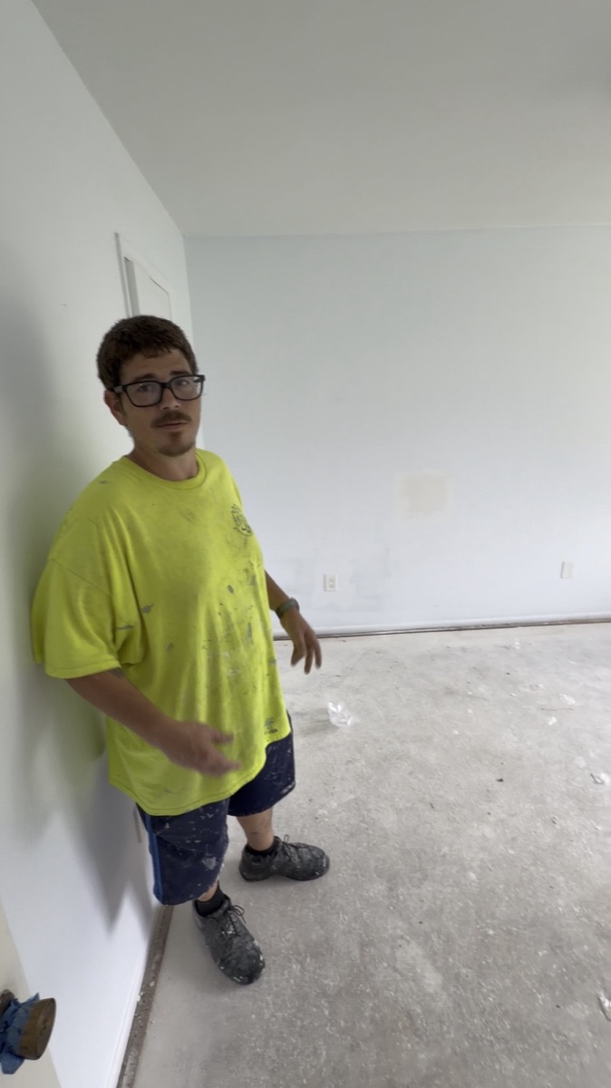 Bedroom painted and prepped: walls painted, floor down to the slab for new flooring