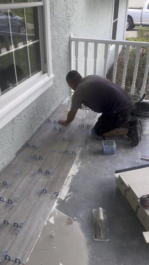 Laying tile on a porch floor